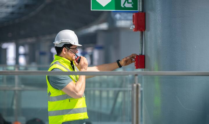 Normec technician inspecting fire safety