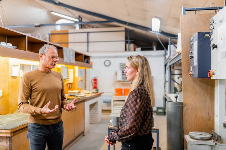Man explaining to woman