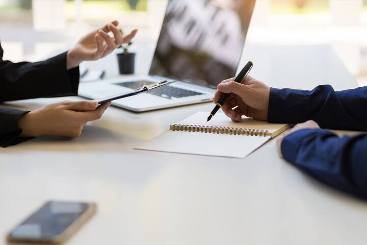 Businessman or insurance agent discussing with customers.