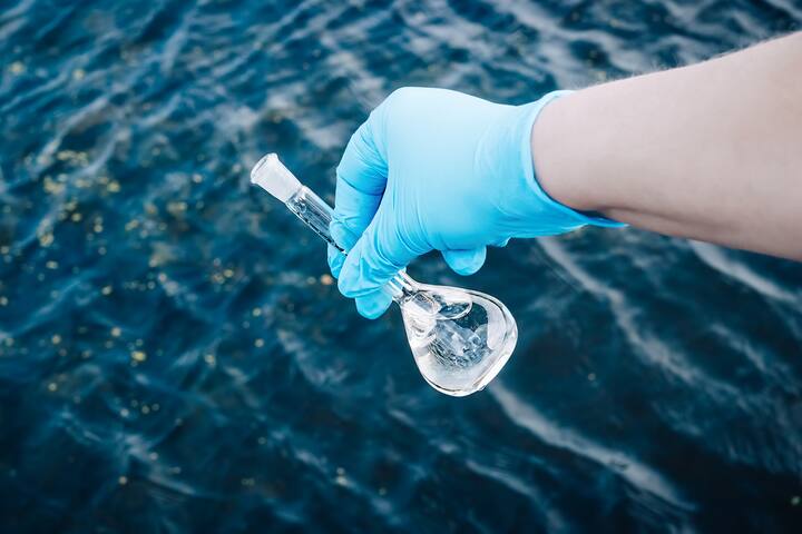 A water sample from the river. Water intake. Water abstraction. Water diversion.