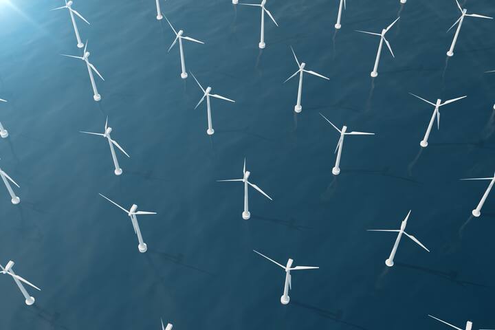 Offshore aerial view of wind turbines in the sea. Clean energy, ecological concept.,3d rendering
