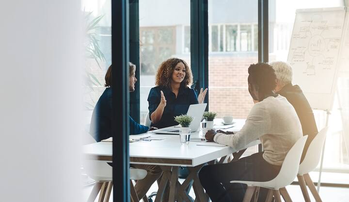 Planning, teamwork and meeting with business people in boardroom for strategy, brainstorming and solution. Corporate, collaboration and conference with employees in office for negotiation development.