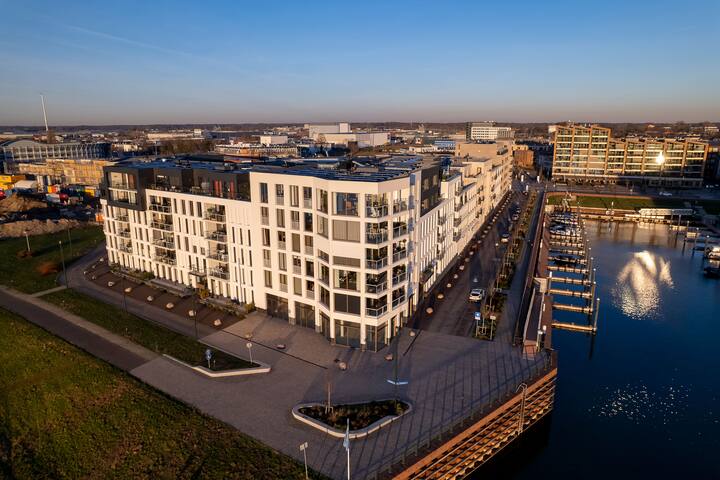 Exterior facade of Noorderhaven neighbourhood real estate at riverbed of the IJssel in Zutphen, The Netherlands, under construction.