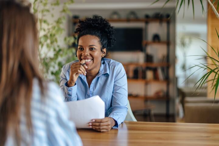 Laughing african-american woman, expressing joy about the interview