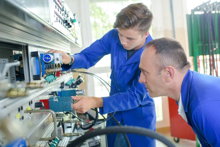 Apprentice electrician under supervision