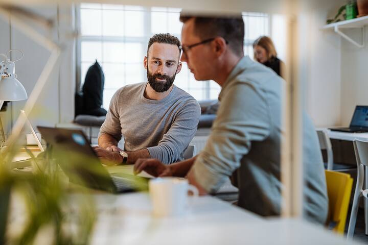 Diverse entrepreneurs and small business owners working in coworking space.Programmers and software engineers working in office