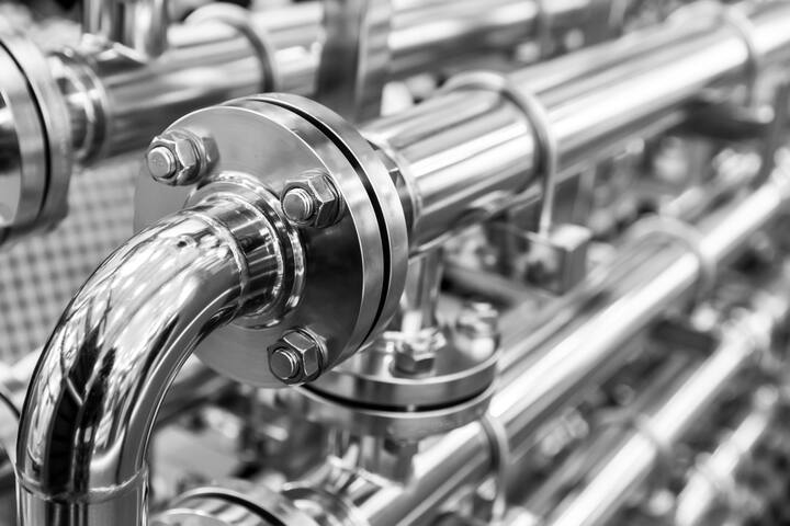 Steel water pipeline, chrome pipes, closeup. Reliable plumbing engineering technology