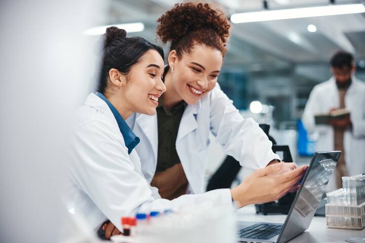 Scientists smiling in lab